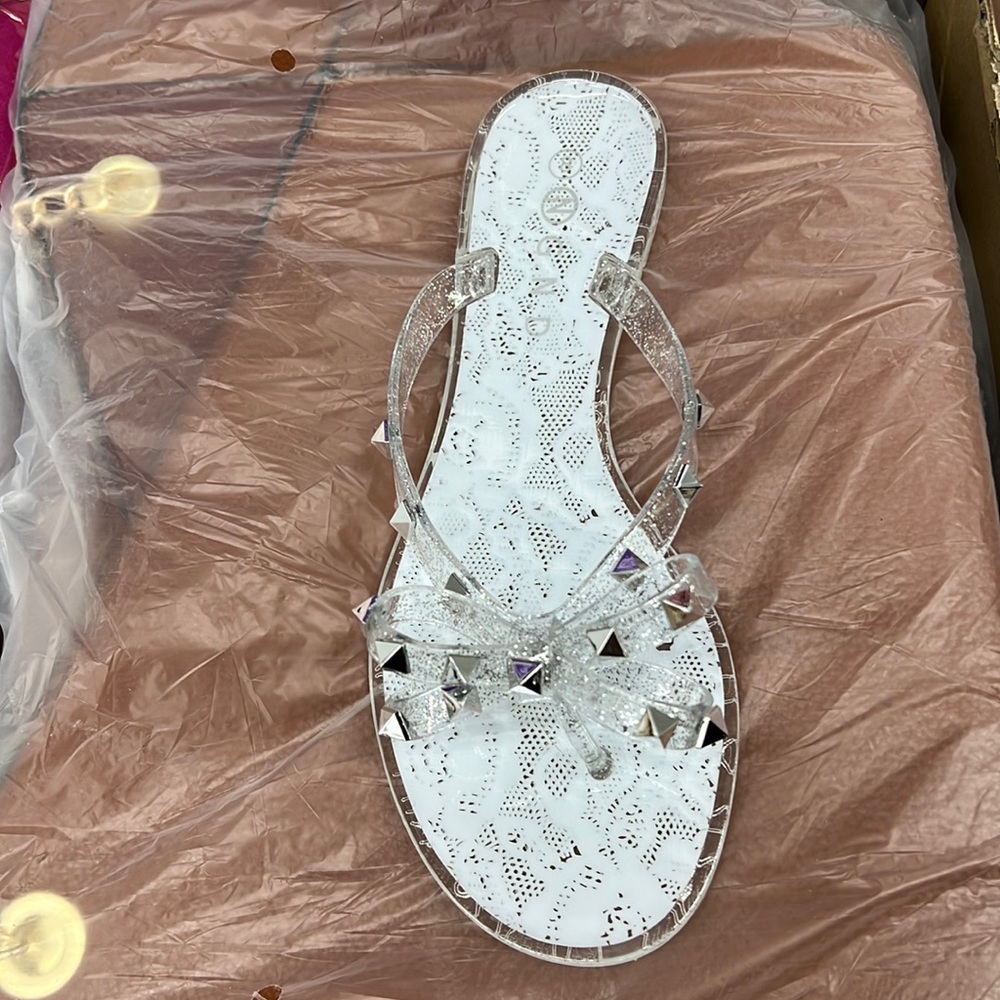 CLEAR BLACK AND PINK FLIP FLOPS